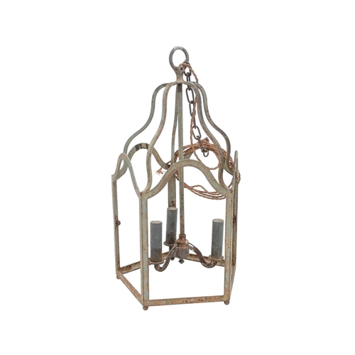 523 - An iron pentagonal three light hall lantern. Height 51.5cm, width 28cm.