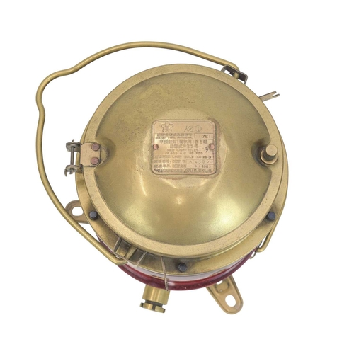 526 - A brass-cased nautical light. By Japanese company Nippon Sento Co Ltd, ribbed red plastic, with bras... 