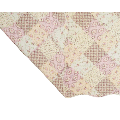 545 - Two patchwork quilts. 20th century, one patchwork floral pink quilt with scalloped edging, 243cm x 2... 