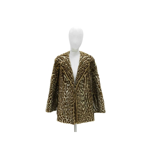 546 - Fur. A 1950s ocelot fur coat with lapel collar, bearing label for Fenwick of Newcastle French Salon,... 
