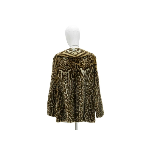 546 - Fur. A 1950s ocelot fur coat with lapel collar, bearing label for Fenwick of Newcastle French Salon,... 