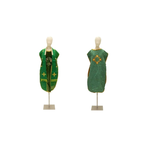 551 - Liturgical Vestments - a green velvet and brocade chasuble, with yellow border and lining. 20th cent... 