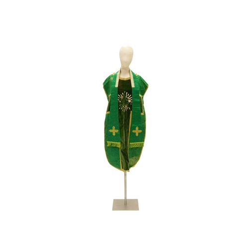 551 - Liturgical Vestments - a green velvet and brocade chasuble, with yellow border and lining. 20th cent... 