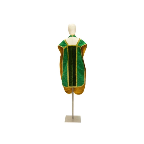 551 - Liturgical Vestments - a green velvet and brocade chasuble, with yellow border and lining. 20th cent... 