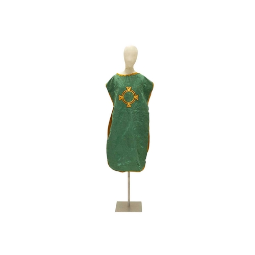 551 - Liturgical Vestments - a green velvet and brocade chasuble, with yellow border and lining. 20th cent... 