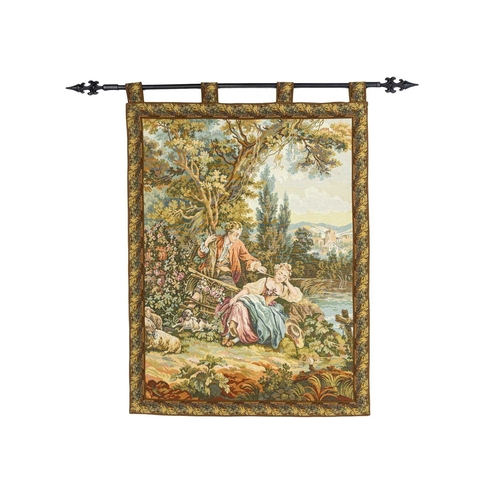 554 - A French tapestry wall hanging. 20th century, featuring a couple in a pastoral scene, 106 x 80cm, wi... 
