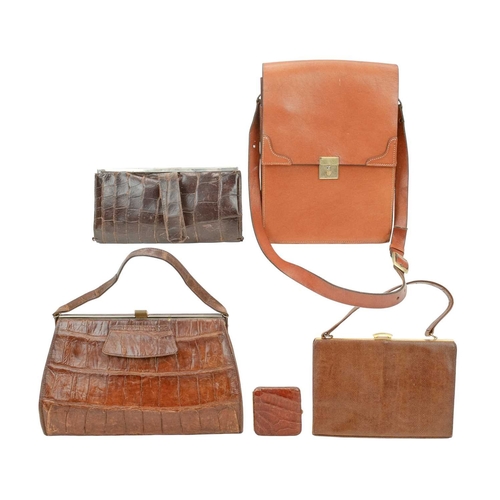 558 - A crocodile skin handbag with matching purse. Circa 1940/1950, clasp fastening, suede lining with in... 