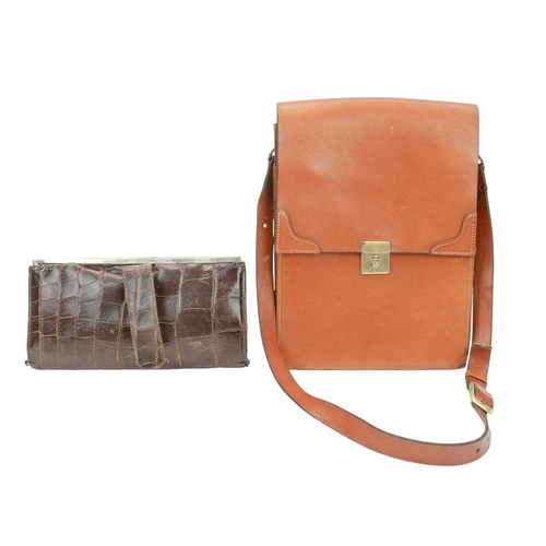 558 - A crocodile skin handbag with matching purse. Circa 1940/1950, clasp fastening, suede lining with in... 