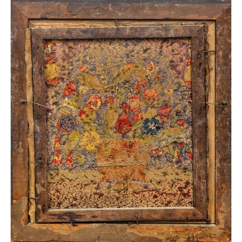 561 - A Regency needlepoint embroidered picture. Worked with a basket of flowers, 41 x 37cm, in a maple fr... 