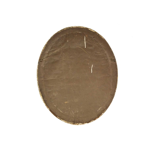 563 - A Regency oval silkwork picture. The central panel worked with a seated lady holding a garland, and ... 