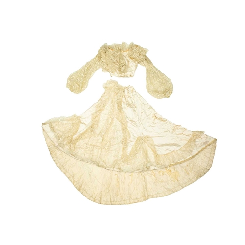 569 - A late Victorian ivory silk two-piece wedding dress. The boned bodice with lace overlay and sleeves,... 