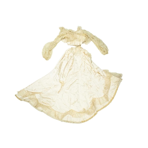 569 - A late Victorian ivory silk two-piece wedding dress. The boned bodice with lace overlay and sleeves,... 