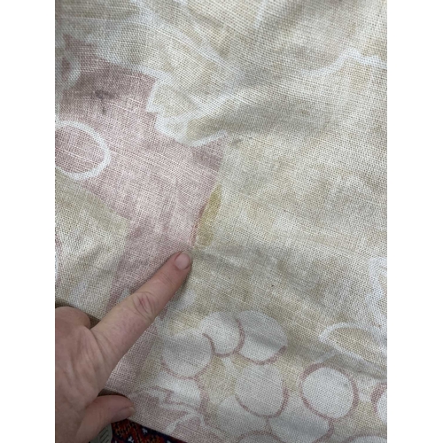 570 - A pair of linen curtains. Patterned with fruiting vine leaves in pink and beige, pleat top with cott... 