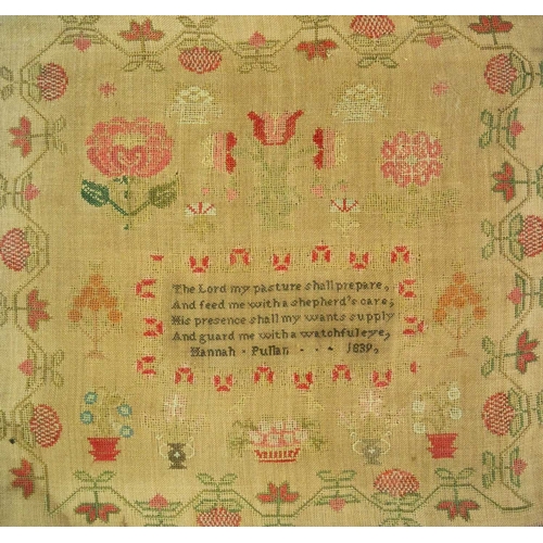 581 - An early Victorian woolwork sampler by Hannah Pulhan, 1839. Worked with trailing flowers and foliage... 