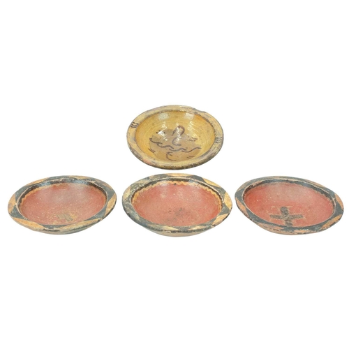 594 - A glazed conical pottery bowl. North African, 19th century, painted with a simple design, height 7.5... 