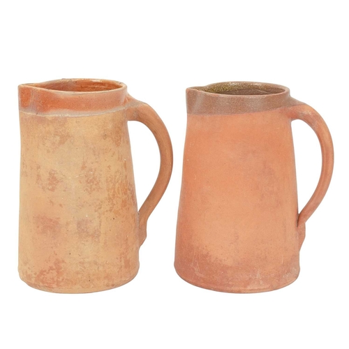 599 - Lakes Cornish pottery, Truro. Three terracotta jugs, the largest 20.5cm, all marked, together with a... 