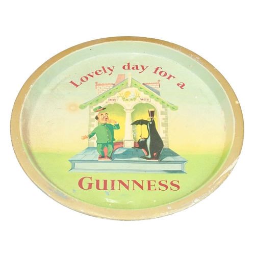 6 - A Guinness advertising tray. Zoo keeper design, diameter 32cm, with a Teacher's Whisky pine box, 'Th... 