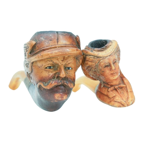 60 - A small collection of pipes. Including two Meerschaum head examples, one with inset eyes, four other... 