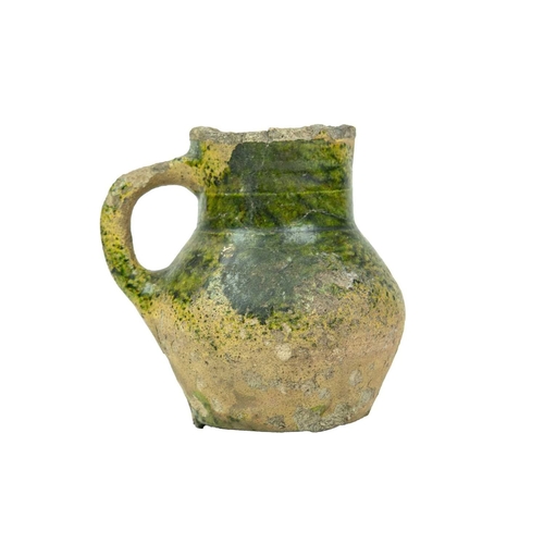 601 - An English medieval jug. 14th-15th century, so-called Border ware, with a grooved cylindrical neck, ... 