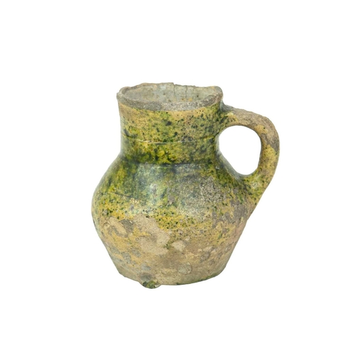 601 - An English medieval jug. 14th-15th century, so-called Border ware, with a grooved cylindrical neck, ... 