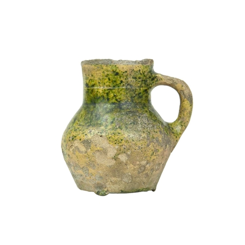 601 - An English medieval jug. 14th-15th century, so-called Border ware, with a grooved cylindrical neck, ... 