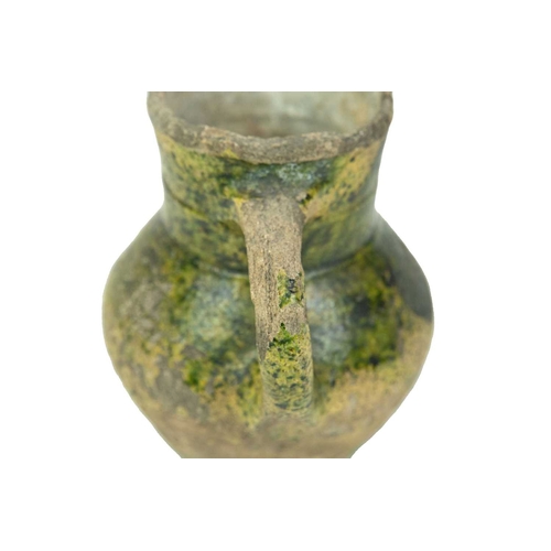 601 - An English medieval jug. 14th-15th century, so-called Border ware, with a grooved cylindrical neck, ... 