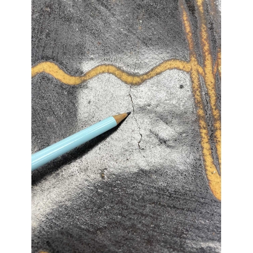 612 - A slipware rectangular dish. 18th century, with a honey coloured trailed pattern on a deep brown gro... 