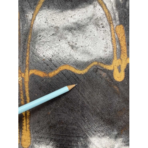 612 - A slipware rectangular dish. 18th century, with a honey coloured trailed pattern on a deep brown gro... 