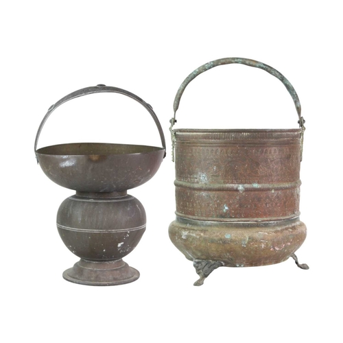 62 - A brass Indian Kamandalu water pot. Early 20th century, with simple banded decoration, the handle de... 