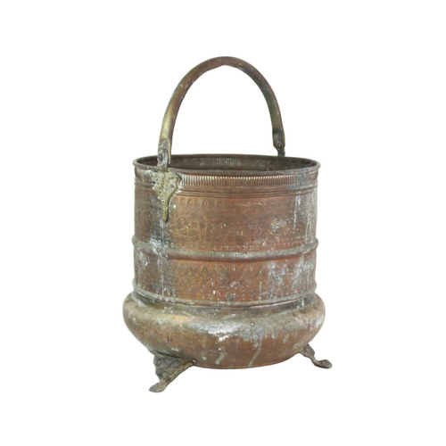 62 - A brass Indian Kamandalu water pot. Early 20th century, with simple banded decoration, the handle de... 