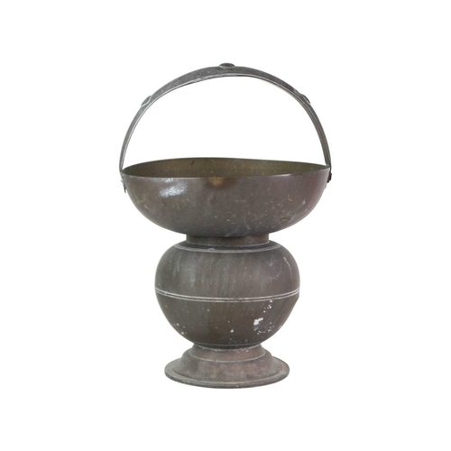 62 - A brass Indian Kamandalu water pot. Early 20th century, with simple banded decoration, the handle de... 