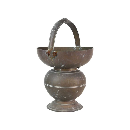 62 - A brass Indian Kamandalu water pot. Early 20th century, with simple banded decoration, the handle de... 
