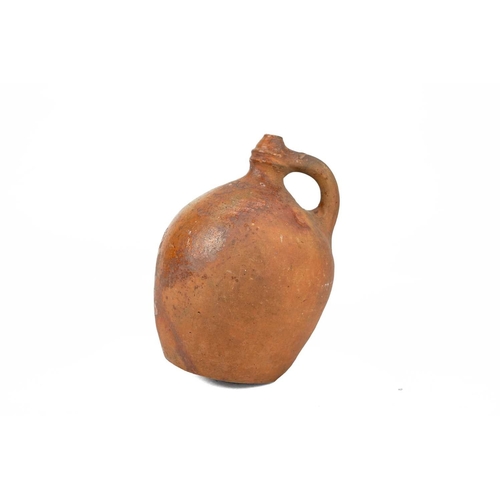 623 - A rare late Medieval pottery water sprinkler. Probably London, 17th century, of jug shape, the arche... 