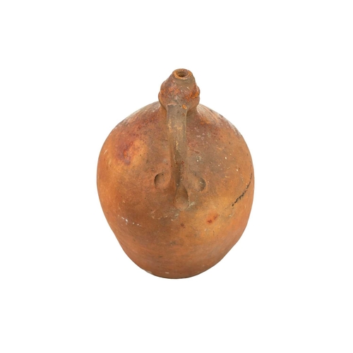 623 - A rare late Medieval pottery water sprinkler. Probably London, 17th century, of jug shape, the arche... 