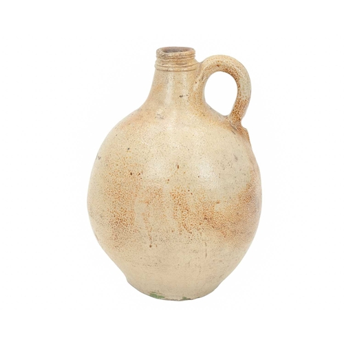 624 - An English salt glazed wine jug or flagon. Probably London, circa 1670, of bellied form, with a typi... 