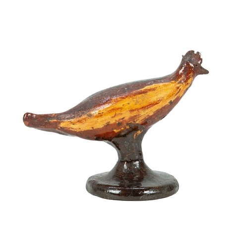 626 - A primitive slipware pottery bird whistle. Early-mid 19th century, on a waisted circular base, heigh... 