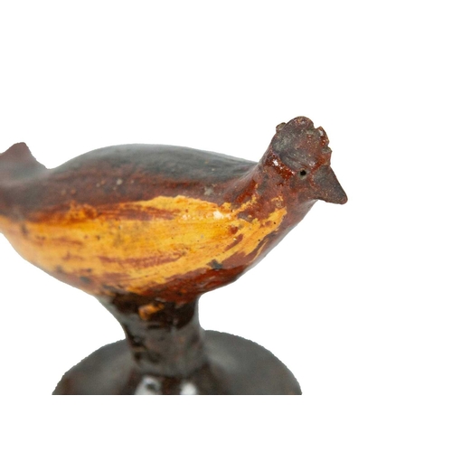 626 - A primitive slipware pottery bird whistle. Early-mid 19th century, on a waisted circular base, heigh... 
