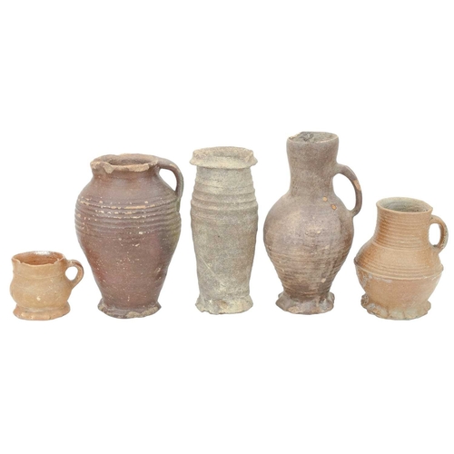 627 - German medieval pots. 14th-16th century, comprising three jugs, with ribbed turning and thumb moulde... 