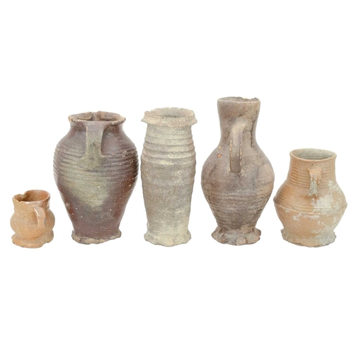 627 - German medieval pots. 14th-16th century, comprising three jugs, with ribbed turning and thumb moulde... 