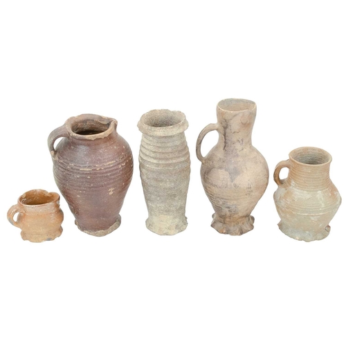 627 - German medieval pots. 14th-16th century, comprising three jugs, with ribbed turning and thumb moulde... 