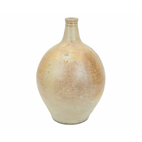 628 - A large English salt glazed wine jug or flagon. Circa 1630, with a typical mottled glaze and narrow ... 