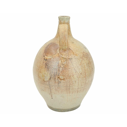 628 - A large English salt glazed wine jug or flagon. Circa 1630, with a typical mottled glaze and narrow ... 