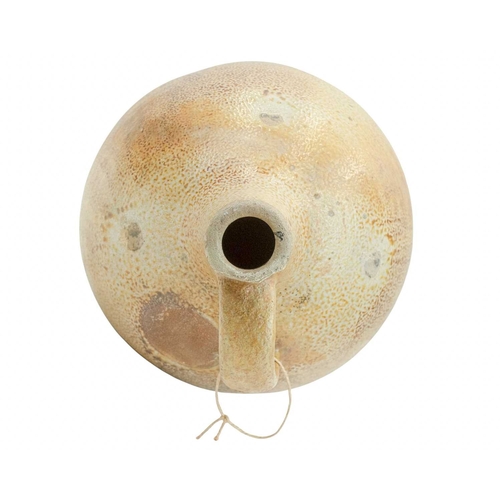 628 - A large English salt glazed wine jug or flagon. Circa 1630, with a typical mottled glaze and narrow ... 