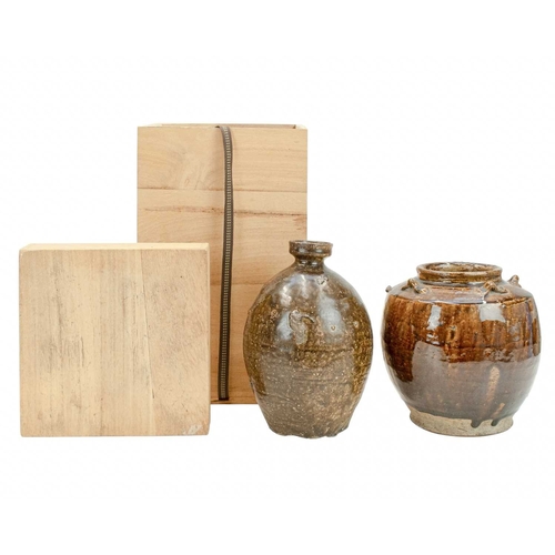 632 - Two Korean pots. 18th century or earlier, each with a deep brown glaze, the first with an ovoid body... 