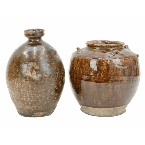 632 - Two Korean pots. 18th century or earlier, each with a deep brown glaze, the first with an ovoid body... 