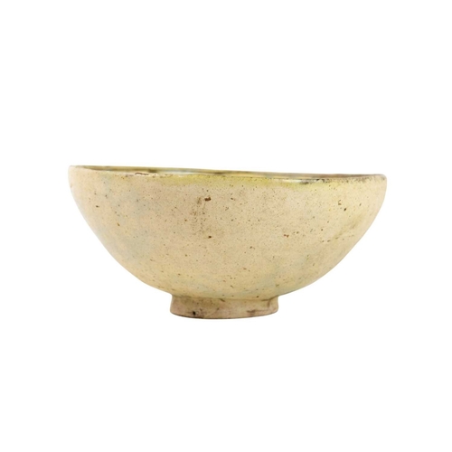 646 - A Persian Kashan bowl. Incised and painted with a horse and rider, height 9cm, diameter 19.5cm. The ... 