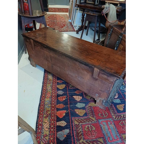 651 - An Italian walnut cassone. 18th century, the hinged lid with a gadrooned edge, the well carved front... 