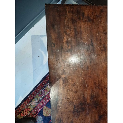 651 - An Italian walnut cassone. 18th century, the hinged lid with a gadrooned edge, the well carved front... 