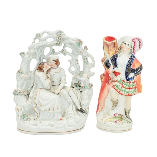 653 - Seven Victorian Staffordshire figures and groups. Including a porcelanous group of lovers under an a... 