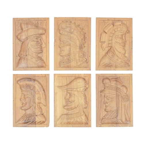 656 - A group of six carved oak panels. 20th century, carved with male or female masks, each 27.5 x 19cm (... 